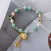 Pulseira de liga metálica com pingente de pérola de cristal natural e caractere "Fu" mais vendida, moderna e de alta qualidade, adequada para o uso diário de mulheres
