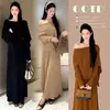 Elegante atuendo de otoño para mujer: un conjunto de dos piezas nuevo, chic y de corte holgado que presenta un top de punto con manga murciélago y una falda midi plisada