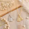 Collar de Candado de Trébol de Cuatro Hojas Acero de Titanio Color Conservante Pequeño Colgante de Candado Incrustado de Diamantes Cadena de Clavícula de Lujo de Nicho para Mujer En Stock