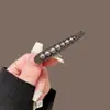 Elegante pasador de perlas para mujer, pinza metálica negra con lazo para el pelo, pinza lateral de alta gama, pinza para flequillo, pinza de pico de pato simple