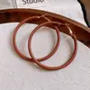 Pendientes Colgantes Redondos Envueltos en Cuero de Aguja Plateada, Sensación de Lujo Ligero y Gama Alta, Pendientes de Moda Vintage con un Diseño Único