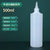 Venta al por mayor de fábrica botella de color tinte pintado de 500 ml botella dispensadora de apretar botella de plástico semitransparente botella de aguja