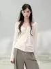 Camisa Henley branca de manga comprida Qiaomi para mulheres, novo modelo outono 2026, saída de praia com proteção solar, blusa de base