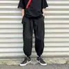 Calça reta estilo dark transfronteiriça para homens, calça de perna larga para primavera e outono com design de cordão na bainha, calça casual cropped de nicho