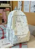 Mochila de tela azul niebla con estampado integral de estrellas, adecuada para estudiantes, diseño suave estilo coreano, ideal para estudio, trabajo, compras y ocio