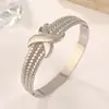 Anillo Sencillo Transfronterizo al por Mayor Pulsera de Acero de Titanio Amor Antiguo Paisaje de Nicho Normcore Joyería de Mano con Forma de Corazón en Espiral al por Mayor