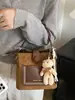 Bolso bandolera retro de nicho estilo coreano para el trabajo y los desplazamientos, que ofrece un ambiente relajado, nueva colección otoño 2026, bolso tipo cubo de alta calidad y moderno