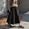 Falda midi gruesa de color gris oscuro con estampado floral para mujer, nueva colección otoño 2026, con cintura elástica, diseñada para estilizar la figura y crear un efecto adelgazante