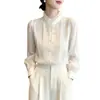 Elegante camisa de cuello alto estilo francés para la primavera 2026, blusa blanca única y nueva de manga larga estilo corte.