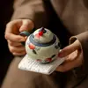 Colección de Teteras de Cerámica Pintadas a Mano Estilo Antiguo con Esmalte Caramelo, Diseños Azul Índigo y Melocotón Rojo para Uso Doméstico, Incluyendo Tetera, Gaiwan, Taza de Maestro y Taza de Té