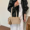 Bolso de mano retro simple de gamuza coreano para mujer Otoño/Invierno 2026 Nuevo para el trabajo Gran capacidad Hombro único Bajo el brazo Bolso pequeño