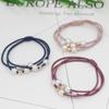 Versión coreana de banda elástica multicapa para el cabello con perlas, banda de goma para el cabello, cuerda para el cabello con lazo simple, lindo y fresco material de joyería para mujeres