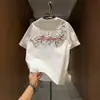 Blusa Floral de Manga Curta Nova Versátil Bordada Estilo Americano Camiseta de Manga Curta Juvenil para Homens Verão Casal Solta Tendência Marca