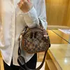 Bolso Redondo Pequeño de Moda de Gama Alta para Dama 2026 Nuevo Bolso de Mano con Estampado Retro Bolso Cruzado de Hombro Único Versátil Casual