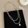 Un collar largo de perlas de estrella multiusos para mujer, ligero, de lujo, de alta gama, exquisito, de moda, versátil, cadena para el cuello, cadena para suéter