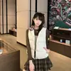 Chaleco chic de retazos a cuadros estilo coreano con cuello alto, una chaqueta acolchada cálida y a prueba de viento para mujeres petite, perfecta para el invierno