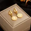 Pendientes de marca redonda de alta calidad retro europeos y americanos estilo frío ins diseño de nicho acero de titanio oro 18K