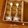 Pendientes de flor de perla con circonita y aguja de plata, pendientes de lujo ligero de alta gama, accesorios dulces y elegantes para vacaciones, pendientes al por mayor
