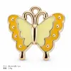 Accesorios para joyería DIY más vendidos a nivel transfronterizo: colgantes, pulseras, pendientes, collares de la serie flor y mariposa, y nuevos dijes para llaveros