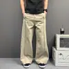 Calça casual de perna larga com corte tridimensional em estilo retrô na cor cáqui, adequada para o dia a dia, solta e respirável, valoriza o formato da perna, calça reta