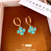 Aretes Sonajeros de Esmeralda y OroAretes de flor con circonita cúbica bañados en oro real, un diseño lujoso y de alta gama, aretes estilo vintage para mujer