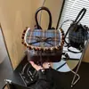 Bolso de Cuadros de Alta Gama para Mujer Transfronterizo Otoño e Invierno 2026 Nueva Moda Lazo Elegante Versátil Mini Mochila Tendencia