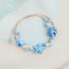 Jingdezhen Navidad Pulsera de Cuerda Trenzada de Cerámica Pulsera de Trébol de Cuatro Hojas Joyería Artística Hecha a Mano Venta al por Mayor Pulseras de Cerámica para Atracciones Turísticas