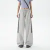 Calça de trabalho larga listrada color block esportiva de secagem rápida nova para primavera e outono para homens e mulheres, apresentando um design curvo estiloso e calças compridas casuais