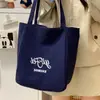 Bolsa de Lona Rayada para Mujer Otoño 2025 Nueva Tendencia Estilo Preppy Coreano Bolsa Tote con Letras Casual Gran Capacidad A39
