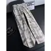 Pantalones casuales de pana a cuadros transfronterizos para hombre, nuevo estilo de otoño, retro americano, cintura elástica, versátiles, corte holgado, pierna recta, largos