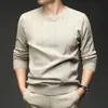 Suéter jacquard de cuello redondo transfronterizo para hombre, nuevo modelo de otoño 2026, color liso, capa interior casual simple, suéter de punto para hombre