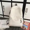 Mochila estudantil moderna e versátil, grande capacidade, leve, design simples, adequada para o trajeto diário, com um toque de alta qualidade