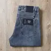Estação Europeia primavera e verão novo algodão puro azul lavado Jovem Avançado micro elástico jeans casual slim reto masculino