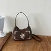 Bolsa de arte bordada com nota musical para mulheres, novo estilo 2026, bolsa tote e de ombro versátil, prática para o dia a dia, bolsa de antebraço em camurça sintética, transfronteiriça