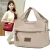 Bolsa de ombro feminina 2026 primavera e outono novo tecido de nylon bolsa de mão urbana simples casual bolsa de mãe bolsa transversal