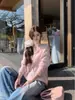Tejido de punto con borde enrollado ligeramente transparente y manga larga, nuevo estilo Primavera y Verano 2026, fino, holgado, para aire acondicionado, protector solar, top chic para mujer
