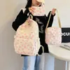 Conjunto de bolsa de três peças novo transfronteiriço mochila feminina para estudante universitária mochila de grande capacidade mochila casual de viagem versátil e moderna bolsa de ombro dupla