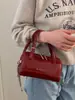 Bolso de Mano con Textura Retro Bolso Tote Pequeño para Mujer 2026 Primavera Nuevo Estilo Bolso Simple Tipo Almohada Bolso Cruzado con Cadena para Hombro