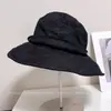 Chapéu de pescador respirável e versátil de aba larga com proteção solar para mulheres, novo estilo casual de verão, chapéu bucket que afina o rosto, chapéu de tecido para proteger do sol