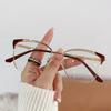 Gafas de moda con montura metálica antiazul, modernas, con diseño de ojo de gato, con bordes ahuecados, para mujeres europeas y americanas de alta gama.