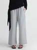 Nuevos pantalones de chándal casual rectos de otoño para mujer, corte holgado, color liso, cintura elástica, pantalones largos de pierna ancha con sensación relajada y bordes deshilachados, al por mayor
