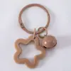 Llavero con Colgante de Campana de Estrella de Cinco Puntas de Colores Caramelo de Aleación Cubierta para Auriculares Decoración de Pareja