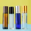 Botella de empaque de perfume de 10 ml tapa con veta de madera botella de vidrio transparente esmerilado botella de color con bola rodante tapa botella de aceite en stock