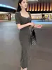 Conjunto de Dos Piezas de Falda Larga con Tirantes Plisada de Cuello de Pila Ajustada de Nuevo Estilo Primavera-Verano de Dongdaemun, Corea del Sur + Cárdigan de Manga Corta
