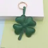 Llavero de trébol de cuatro hojas de la suerte japonés y coreano transfronterizo, amuleto de cuero, accesorio dulce para bolso de pareja, amuleto acolchado