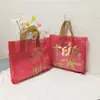Tienda de Ropa Bolso Sentido Premium Bolsa de Regalo Cosméticos de Mujer Rica Bolsa de Embalaje de Plástico Engrosado Rojo Festivo
