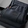 Pantalones deportivos para hombre al por mayor transfronterizos, nuevo modelo primavera y otoño 2026, pierna recta, corte holgado, gris, pantalones casuales de negocios de alta gama para hombre