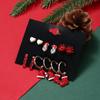 Pendientes de botón navideños transfronterizos europeos y americanos diseño original muñeco de nieve flor zapatos sombrero corazón de melocotón rojo traje minimalista pendientes de botón
