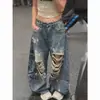Pantalones vaqueros retro americanos desgastados con salpicaduras de tinta y detalles rotos, nuevo estilo primavera/otoño para mujer, con un estampado de letras de moda y un diseño de longitud hasta el suelo