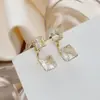 Aretes de Hilo Hueco Estilo Coreano Aguja Plateada Gama Alta Enrollado de Hilo Cuadrado Pequeño de Diamante Zirconia Aretes Sencillos Venta al por Mayor